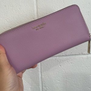 Purple Kate Spade zip-around wallet
